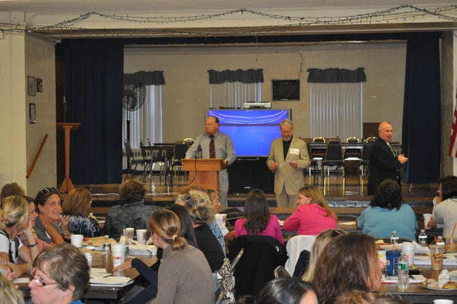 St. Joseph’s School Principal Jim Deveney addresses the crowd gathered at the school for a conference.