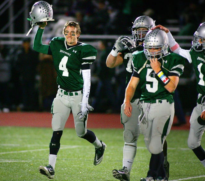 Duxbury 4 Adam Martin, 5 Henry Buonagurio and Tucker Hannon celebrate victory. Duxbury football earned a birth in Saturday's Super Bowl after defeating Dennis-Yarmouth in a game played at Weymouth High School Tuesday, November 30, 2010.