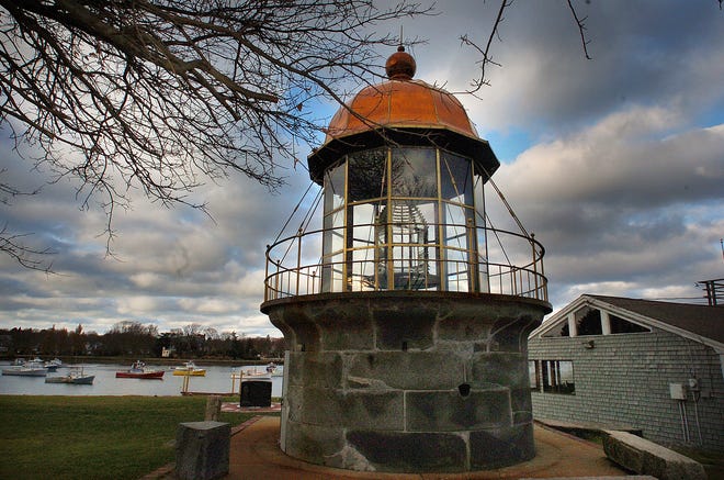 Clouds hover over the replica of the top of Minot’s Ledge Lighthouse on Sunday. The replica is next to Cohasset Harbor.