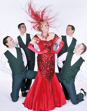 Karen Edissi as Dolly Levi is surrounded by cast members of "Hello, Dolly!"