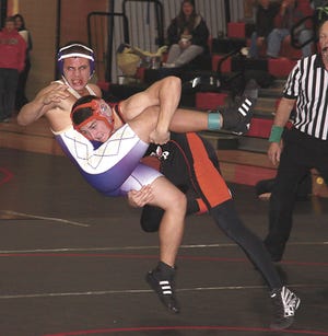 White Pigeon’s John Tullos takes down his Schoolcraft opponent on Wednesday. He won his match 16-4.