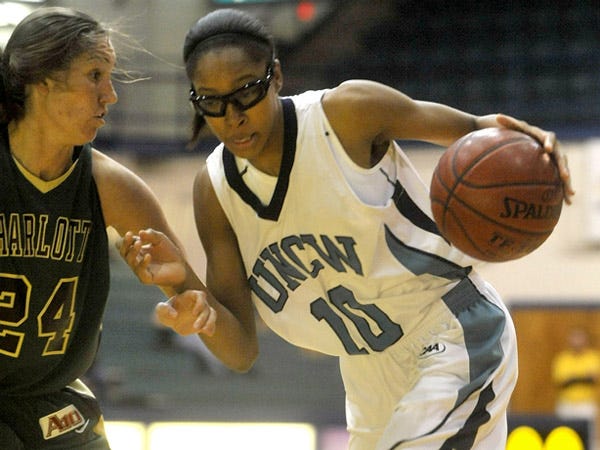 UNCW's Abria Trice drives against Charlotte's Kate Meador on Thursday night at Trask Coliseum.