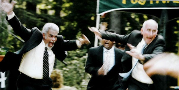 Richard F. Bonavita Jr., left, a former supervisor at the Barnstable County Correctional Facility who is now collecting disability pay for an injury suffered on the job, appears in the movie "Furry Vengeance," a children's comedy in which he performs in an action sequence running then leaping into an amusement park game concession.