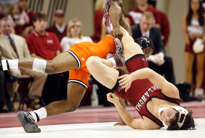 University of Oklahoma's Zack Bailey, bottom, and Oklahoma State's Jamal Parks wrestle in the 141-pound Bedlam college wrestling match between the University of Oklahoma and Oklahoma State University at the Howard McCasland Field House in Norman, Okla., Sunday, Dec. 7, 2008. OU won 18-15. STAFF PHOTO BY SARAH PHIPPS