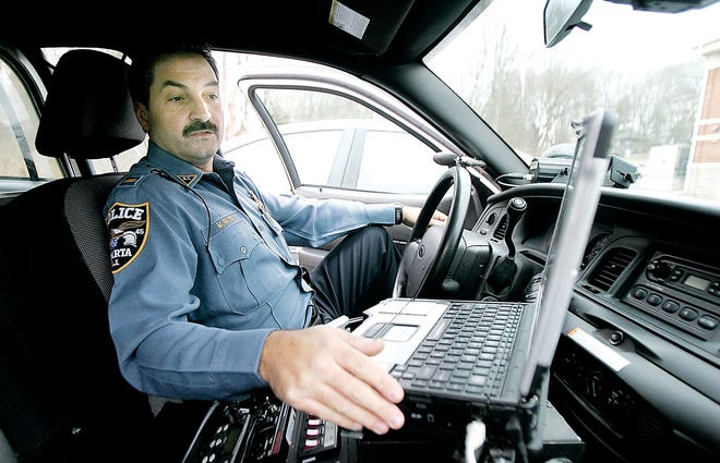 Photo by Amy Paterson/New Jersey Herald
 
Lt. Mark Rozek shows the computer in one of the Sparta Police Department's patrol cars. Technology has significantly altered law enforcement's ability to detect clues to crime.