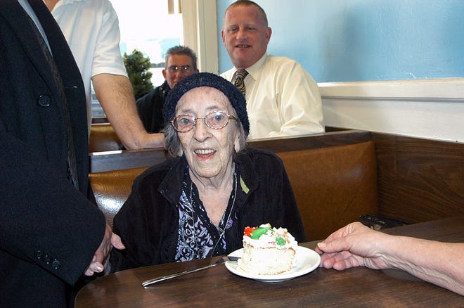 Emma Lopes receives congratulations in Jimmy's Restaurant on the occasion of her 101st birthday.