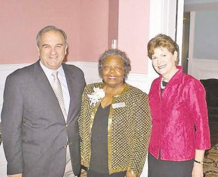 Courtesy photo
Ushering in 
the holiday season
The Seacoast African American Cultural Center (SAACC) held its Annual Holly Day Dinner Dance & Auction recently. Shown is Vernis Jackson, founder and president of SAACC, greeting U.S. Senator Jeanne Shaheen and the honorable Bill Shaheen. Bill Shaheen, the guest auctioneer, helped raised more than $40,000 for scholarships and programming. SAACC was formed 10 years ago to emphasize and preserve the rich African-American culture that exists in the New England region. For information about SAACC, visit the Web site at http://saacc-nh.org.