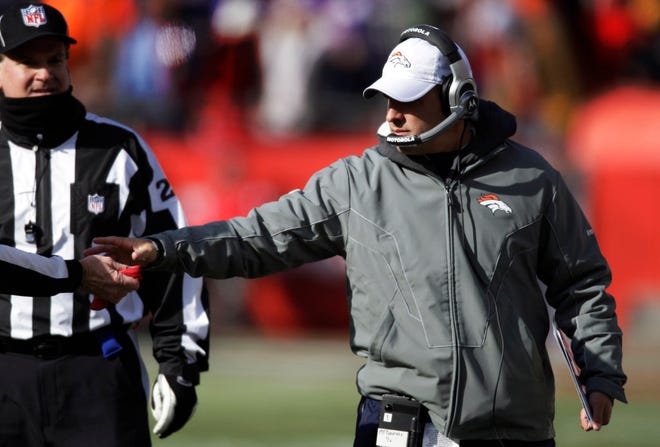 The Denver Broncos fired coach Josh McDaniels, right, on Monday. The Associated Press