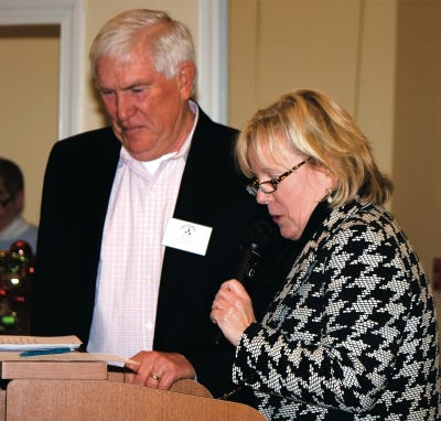 Photo by Krystal Leigh Shadis/For the New Jersey Herald 
Roy Knutsen, of Stillwater, receives the 2010 President’s Award from Deborah Berry-Toon, executive director of Project Self-Sufficiency, Tuesday, at the PSS campus in Newton.