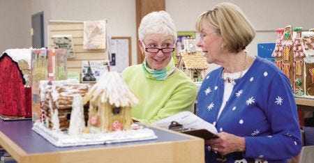 Cynthia Hosmer and Sue Little discuss entries of this years' Gingerbread House contest at the York Public Library Friday.

Amy Root-Donle