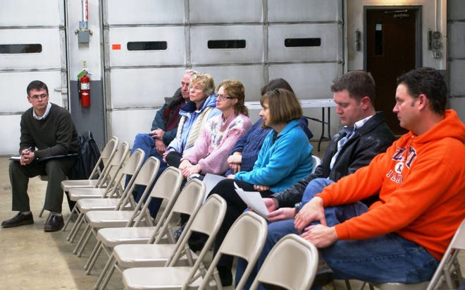 Business owners from Mor-Agra Grain Handling Inc., McDonald Manufacturing Co. and village residents listen to the Caledonia Village Board during a special meeting Tuesday, Dec. 7, 2010.