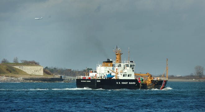 A Coast Guard buoy tender works near Georges Island off Hull on Wednesday, Nov. 17, 2010.