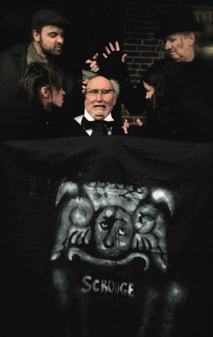 Scrooge (Chuck Galle) haunted by grave robbers, clockwise: Leslie Hamblin, Alanna Bagdon, Liz O’Connell and Paul Hartwell. Photo by Jasmin Hunter