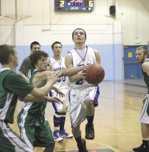 Burr Oak’s Christian Eckert drives to the basket in the Bobcats’ loss to North Adams-Jerome on Thursday.
