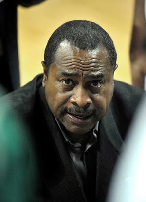 In this photo taken Tuesday, Dec. 7, 2010, Cleveland State head coach Gary Waters talks to his team during a timeout in the second half against West Virginia Tech in an NCAA college basketball game in Cleveland. Cleveland State won 94-62 to move to 11-0. (AP Photo/David Richard)