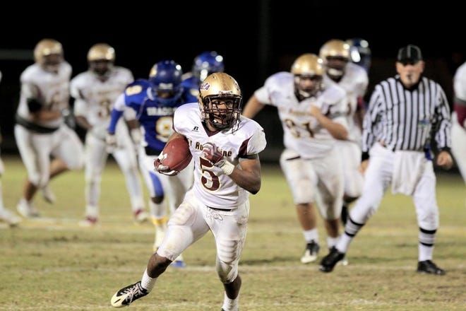 St. Augustine's Wallace Archie runs with the ball Friday against Tampa Jefferson in the Class 3A state semifinal. By GARY MCCULLOUGH, Special to The Record