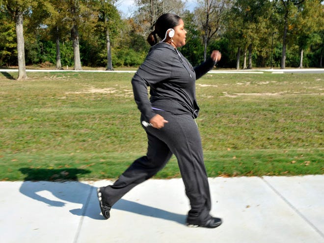 Deidra Atkins-Ball, 44, walks in Baton Rouge, La. Atkins-Ball participated in the Type 2 diabetes fitness program that combined aerobics and weight training.