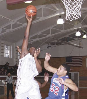 Howe School’s John Jones goes in for two of his 18 points on Saturday.