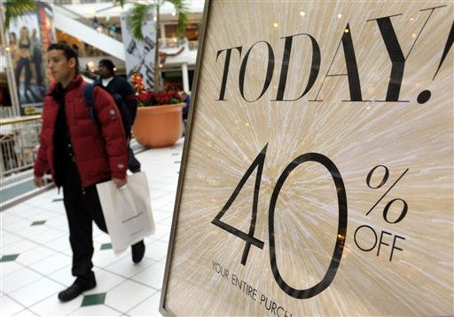 In this Nov. 26, 2010 photo, shoppers take advantage of sales while shopping at the Pentagon City Mall in Arlington, Va. Retail sales rose for a fifth straight month in November as the biggest jump in department store sales in two years got the holiday shopping season off to a jolly start.