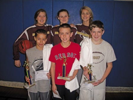 Courtesy photo
Among the competitors in the recent Portsmouth Elks Hoop Shoot were 12- and 13-year old competitors, first row, from left, Romeo Ingram (winner) and runners-up A.J. McManus and Charlie Kendall, shown with PHS varsity basketball players, second row, from left, Kelly MacDonald, Devon Parker and Cielle Collins.