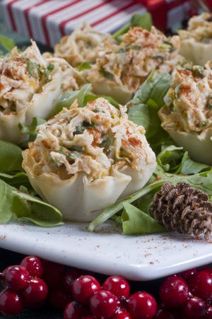 Orange-arugula crab salad bites are seen Oct. 31, 2010 in Concord, N.H. Purchased phyllo cups help make these impressive crab salad bites an easy to make hors d'oeuvre for your next holiday party.  (AP Photo/Larry Crowe)