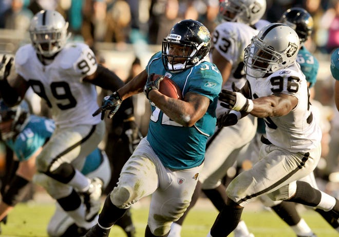 Jacksonville Jaguars running back Maurice Jones-Drew (32) scores on a 30-yard run against the Oakland Raiders during the fourth quarter of an NFL football game, Sunday, Dec. 12, 2010, in Jacksonville, Fla. Jaguars beat the Raiders 38-30. (AP Photo/Stephen Morton)