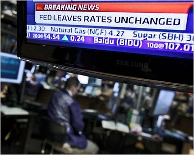 The New York Stock Exchange on Tuesday. A Fed committee voted to keep the benchmark short-term interest rate the same.