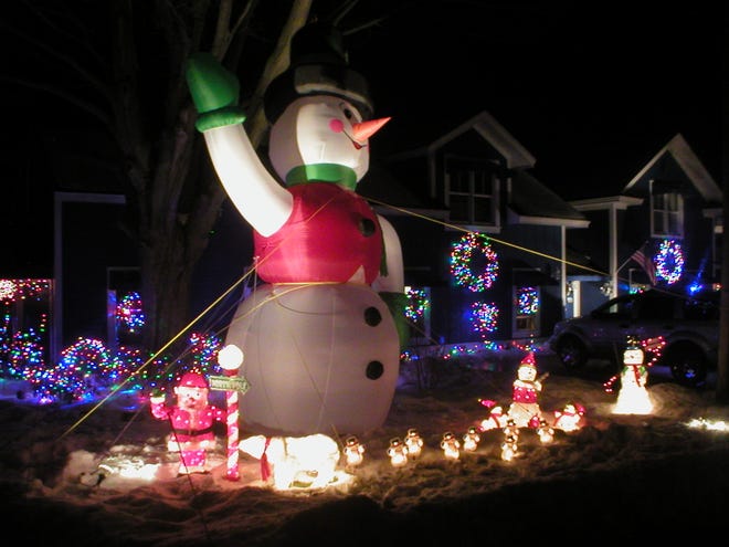 A 20-foot snowman greets visitors to the house at 88 Water St. in Douglas.