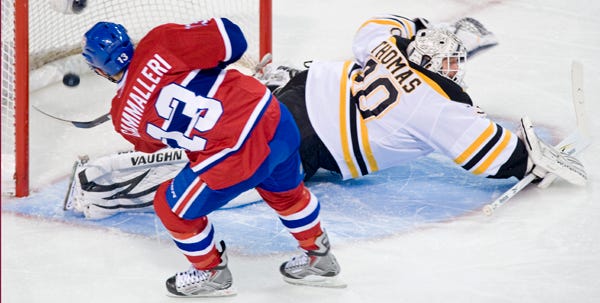 Montreal's Michael Cammalleri scores a penalty shot on Boston goaltender Tim Thomas during the first period of Thursday night's game. The Canadiens won, 4-3.