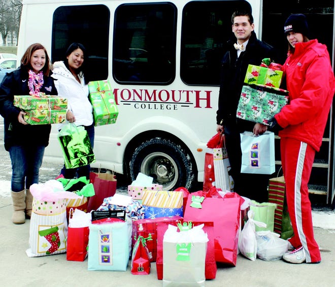 (From left) Monmouth College Student-Athlete Advisory Committee members Hillary Broms, Peoria, Kimi Wegner, Dixon, and Trevor Newton, Lemont, and advisor Melissa Bittner prepare to deliver Angel Tree presents to the Warren Achievement Center. For the second consecutive year, the SAAC members sponsored an Angel Tree to benefit special needs young adults in the Monmouth area.