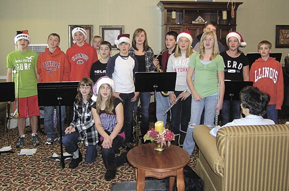 Joanie Shrock’s fifth through eighth grades band and chorus appeared Thursday morning at Woodridge of Pontiac Supportive Living Residence to entertain the residents.
