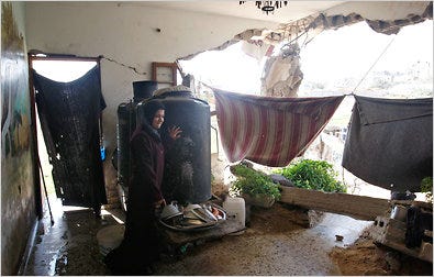 Two years after the Israeli offensive, a Palestinian woman showed visitors in October that her house in Beit Lahiya, Gaza, still had not been repaired.