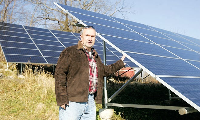 Photo by Amy Paterson/New Jersey Herald
 
Joe Szczesny, an executive committee member for the Church of Good Shepherd in Wantage, talks about the benefits of the solar panels the church has had since 2005. The 126 panels provide about 90 percent of the church's power.
