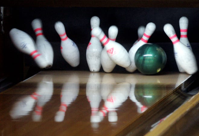A ball breaks through the pins during warm-ups for the USBC bowling tournament at the Cherry Bowl in Cherry Valley.