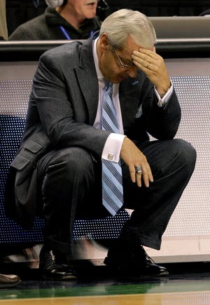 North Carolina coach Roy Williams pauses during the final minutes of a 78-76 loss to Texas in an NCAA college basketball game, Saturday, Dec. 18, 2010, in Greensboro, N.C. (AP Photo/Chuck Burton)