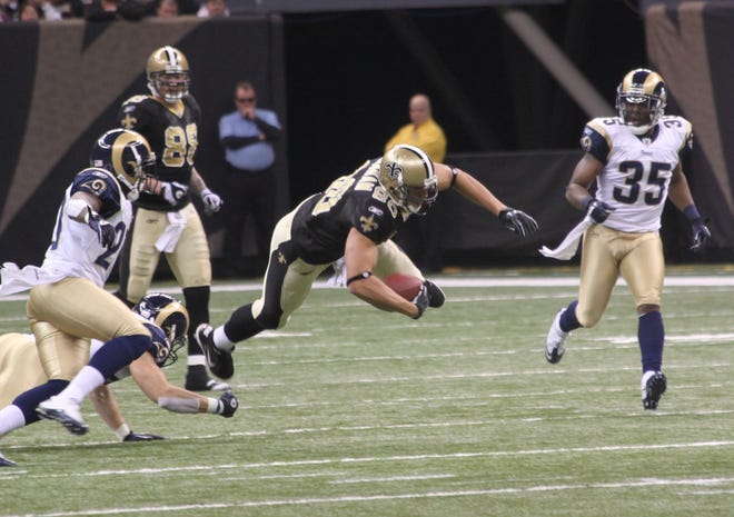 New Orleans Saints tight end Jimmy Graham lunges forward after a catch.