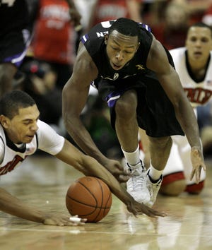 UNLV's Anthony Marshall, left, and Kansas State's Jacob Pullun dive for a loose ball during a Dec. 12, 2009, game in Las Vegas.