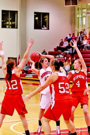 Former Titans Claire McGuire fights a triple team during the Scots’ convincing victory over Ripon Sunday.