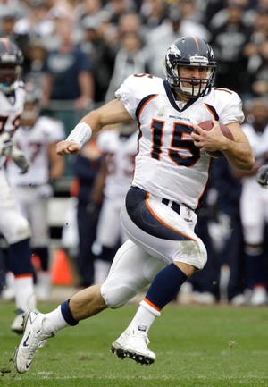 Denver Broncos quarterback Tim Tebow runs for a 40-yard touchdown Sunday against the Oakland Raiders in Oakland. The Associated Press
