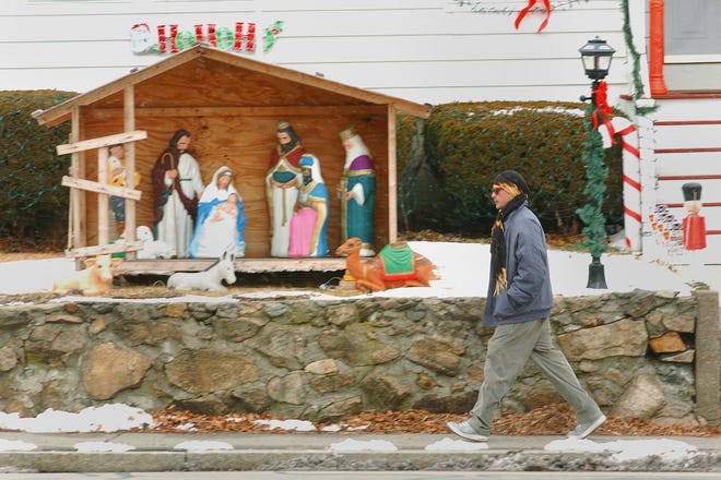 A pedestrian on Broad Street in Weymouth is about to go past a nativity display. The photo was snapped on Wednesday, Dec. 22, 2010.