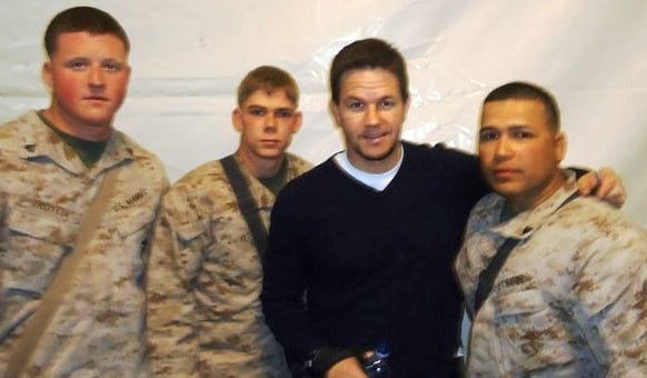 Marines with 1st Marine Logistics Group take a photo with actor Mark Wahlberg during the actor's visit to Camp Leatherneck, Afghanistan, on Dec. 19, 2010. That's Lance Cpl. Richard Waibel of Weymouth, second from the left.
