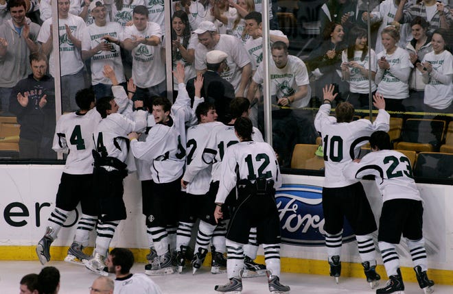 The Canton boys hockey team celebrates with their fans after they defeating Newburyport in the MIAA Boys Division 2 Hockey Championship at TD Garden last winter. Despite the loss of some key players to graduation and transfer, the Bulldogs have their sights set on another title this year.