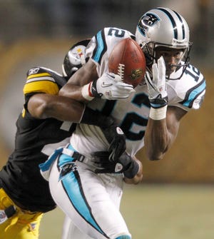 Panthers wide receiver David Gettis makes a catch for a first down as 
Steelers cornerback Bryant McFadden defends during Thursday night's game in 
Pittsburgh.
ASSOCIATED PRESS / KEITH SRAKOCIC