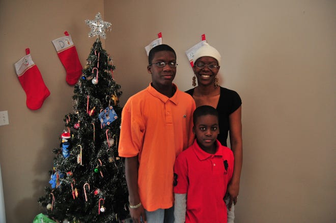 Tonika Brown and her sons, Robert and Xavier Hall, will celebrate Christmas this year in their new home.