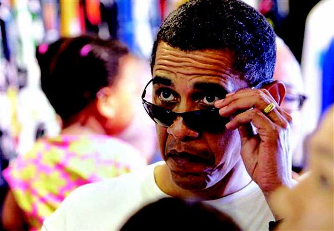 ** ADVANCE FOR USE TUESDAY, DEC. 21, 2010 AND THEREAFTER ** FILE - In this Jan. 1, 2010 file photo, President Barack Obama looks over his sunglasses at the menu of shave ice at Island Snow, in Kailua, Hawaii. Obama's terrible, horrible, no good, very bad year got off to a terrible, horrible, no good, very bad start. (AP Photo/Alex Brandon, File)