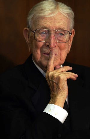 FILE - This April 12, 2003, file photo shows former UCLA coach John Wooden pausing as he takes questions from the media at the Los Angeles Athletic Club. Wooden and George Steinbrenner, two towering figures in sports, died in 2010, each having transformed his game in a distinct but enduring way.(AP Photo/Damian Dovarganes, File)