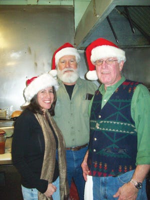 Ellen Chesler, Rip Neary and Steve Carhart were three of the volunteers helping prepare meals at Patty’s Place in Canandaigua on Christmas Day.
