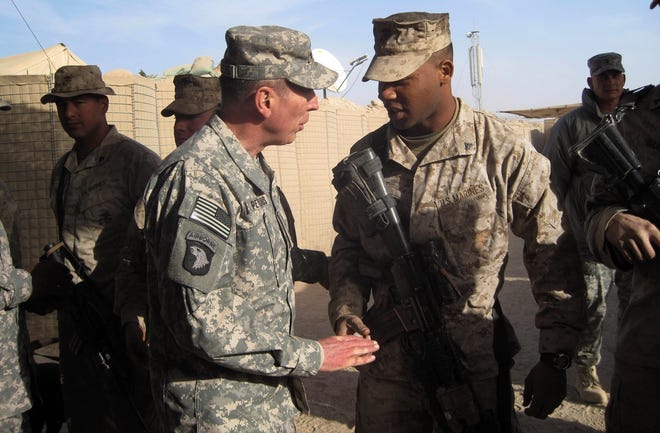 Gen. David Petraeus, top U.S. and NATO commander in Afghanistan, meets 
Marines during a visit Saturday to Marjah, Afghanistan. Petraeus visited 
several troop posts Saturday.ASSOCIATED PRESS / ELENA BECATOROS