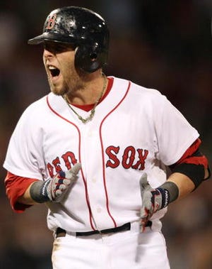 Red Sox second baseman Dustin Pedroia celebrates after driving in a run during the 2010 season.