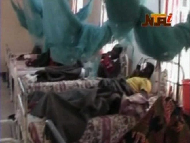 In this image made from video provided NTA via APTN, and taken Saturday, Dec. 25, 2010, patients are seen in hospital beds following violence in Jos, Nigeria. Dozens of people were killed over the holiday weekend in attacks across Nigeria, including 32 that died in central Nigeria in a series of bomb blasts in the worst violence to hit the region in months. (AP Photo/NTA via APTN) NIGERIA OUT